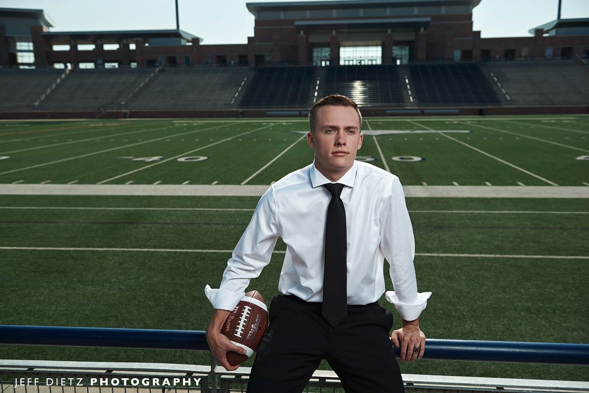 allen senior photos at eagles stadium in the stands overlooking the field