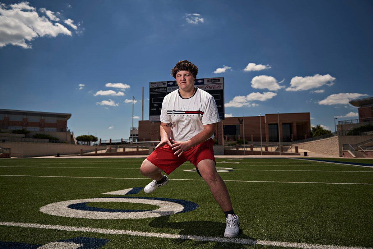 texas football center works out in senior portraits in allen tx