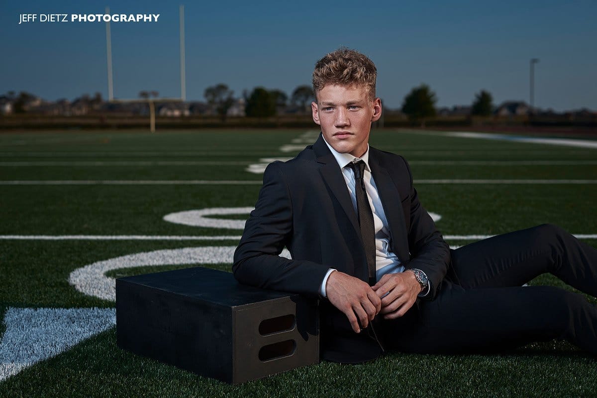 Prosper editorial senior portraits of football player in fashion black suit