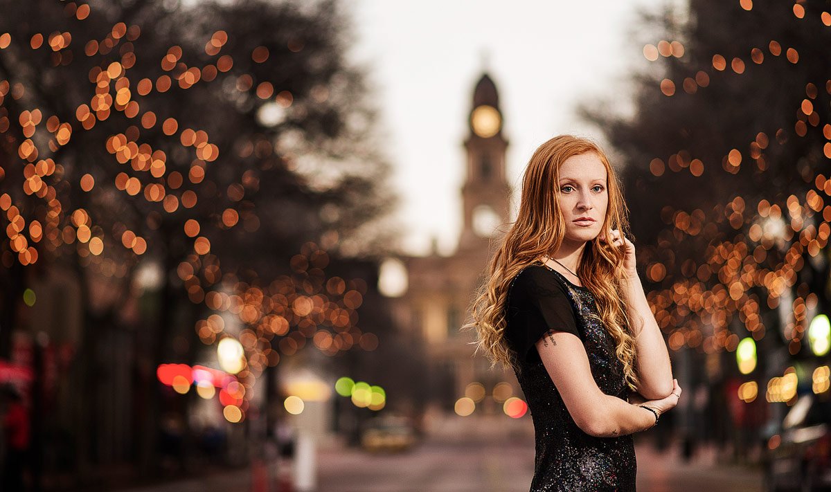 sundance square senior photos with christmas lights in background
