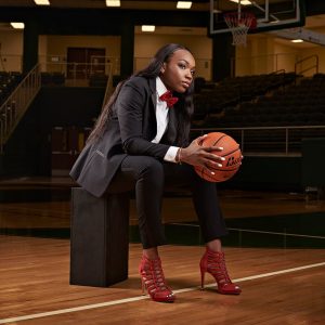 dallas girls basketball senior pictures on court in suit and heels