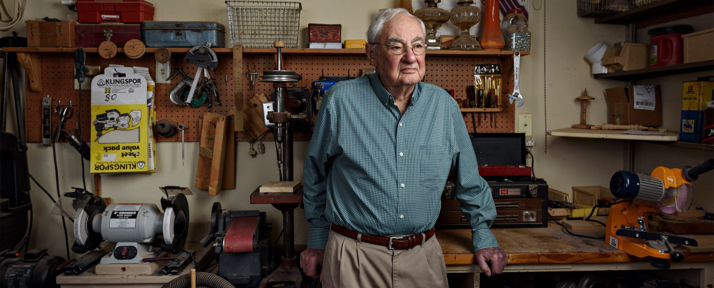 Dallas porrait artist photographs older man in wood shop in mckinney texas