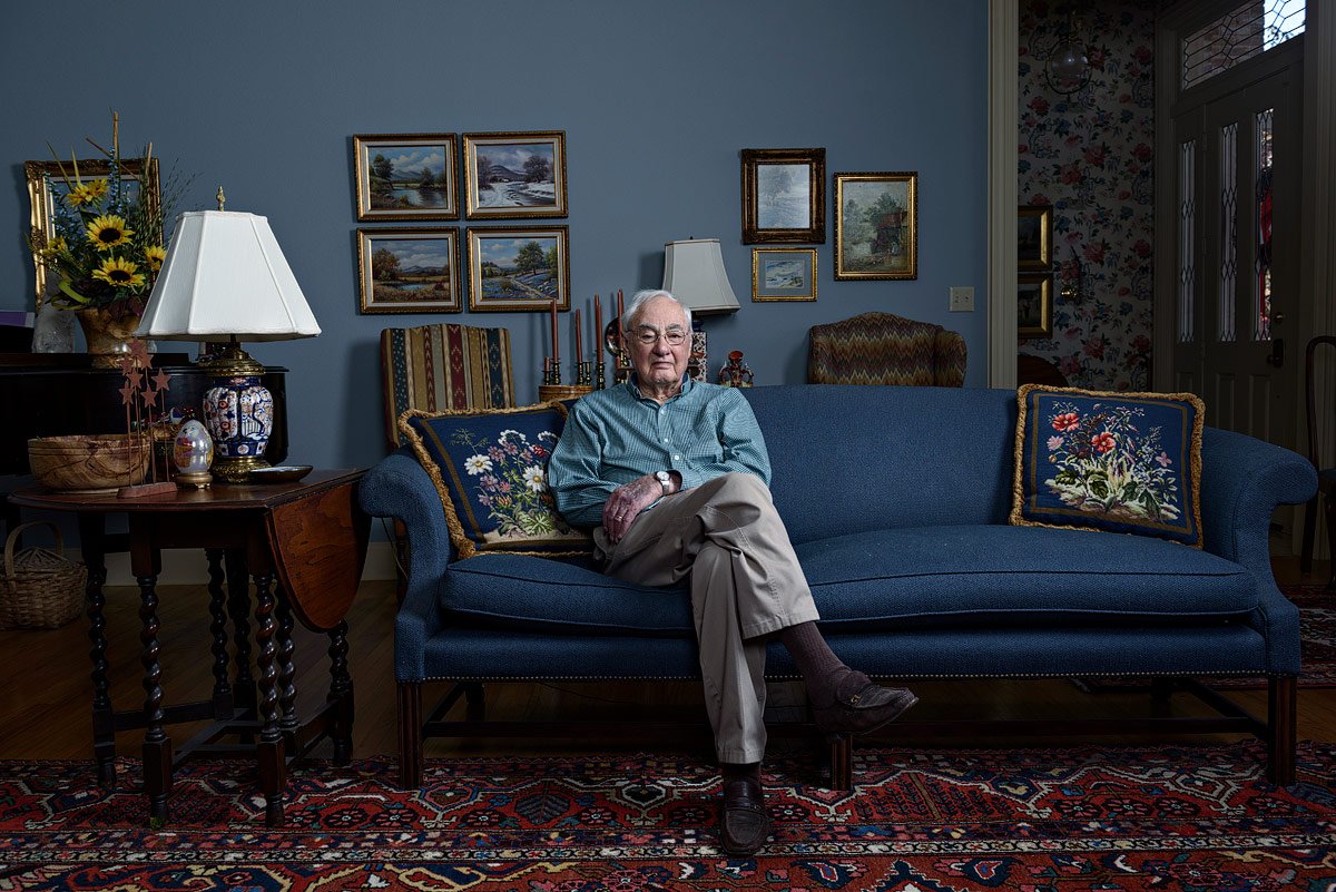dallas portrait artist photographed older generation war veteran on couch in his home in mckinney texas