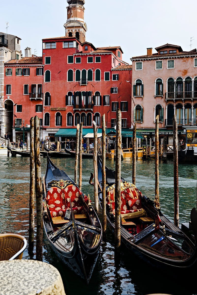 gondola's with red house in venice italy