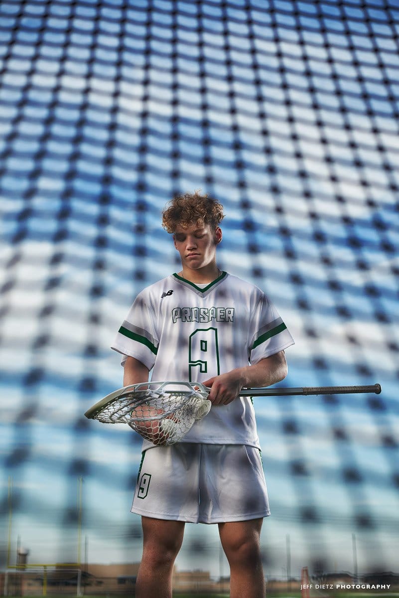 creative lacrosse photo photographed through the net of prosper senior goalie