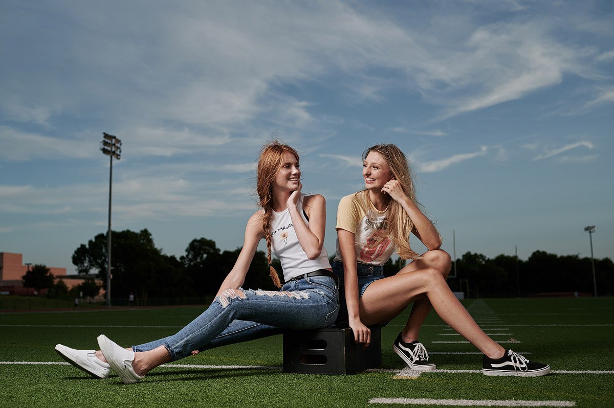 dallas cheerleaders friends for senior portraits in casual jeans and vintage t-shirts
