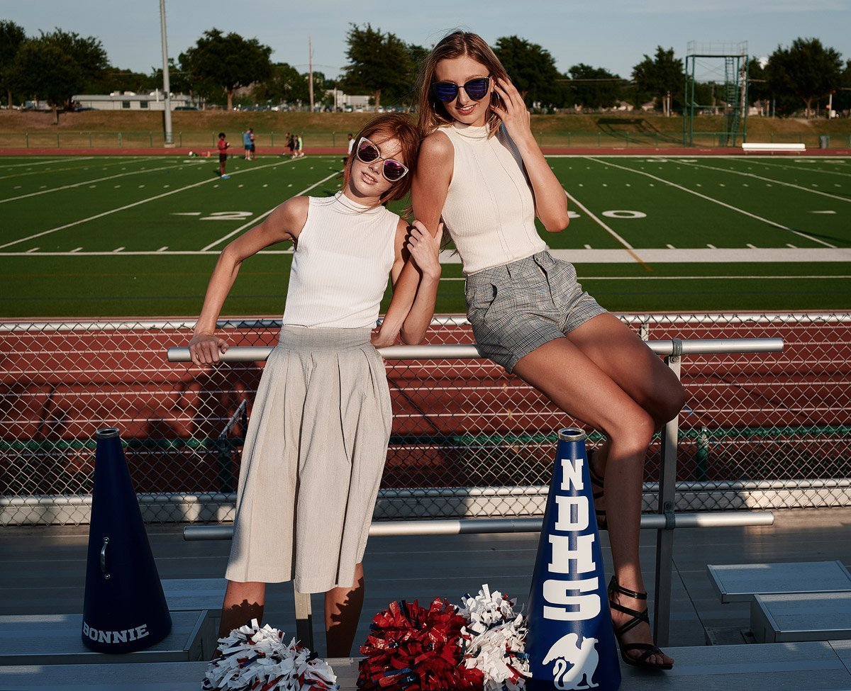 two dallas cheerleaders posing for pictures for senior portraits