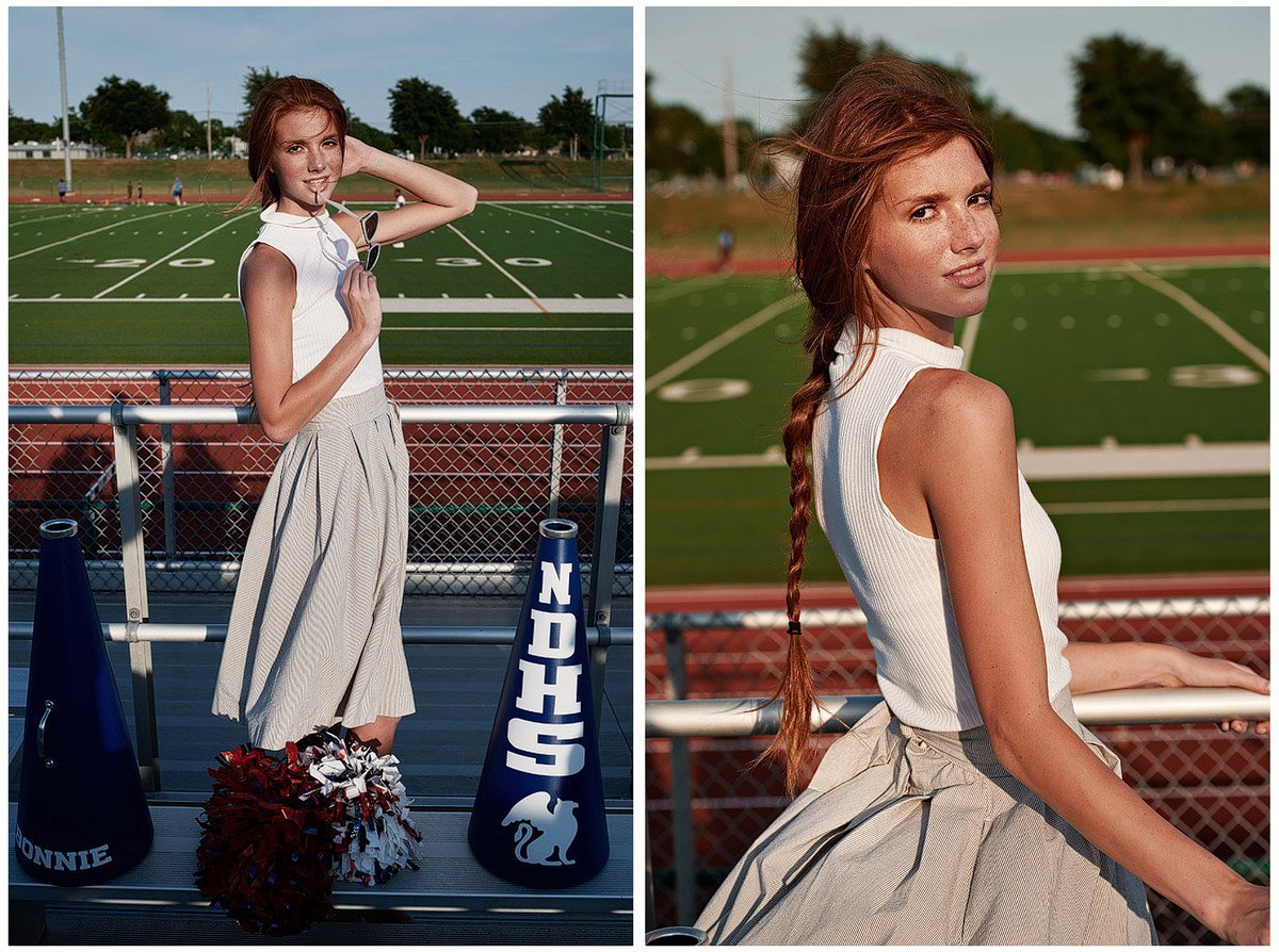 red head allen Cheerleader posing for senior pictures on the field