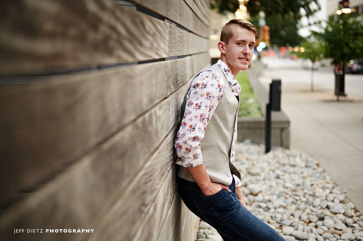 frisco liberty senior boy in a relaxed outfit jeans and vest downtown dallas
