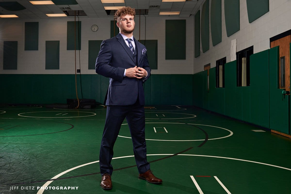 dallas wrestling senior portraits in the gym with a suit