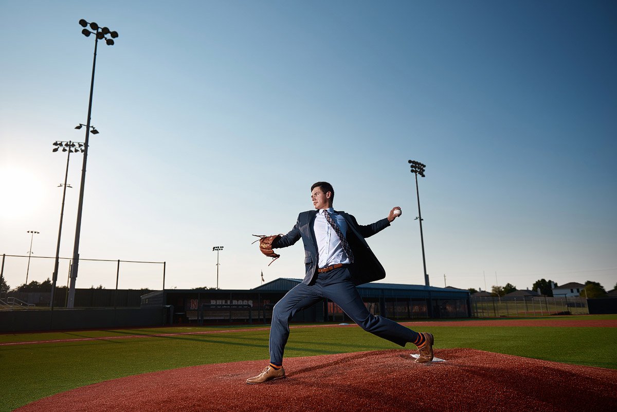 Mckinney north senior baseball pitching from the mound in a suit