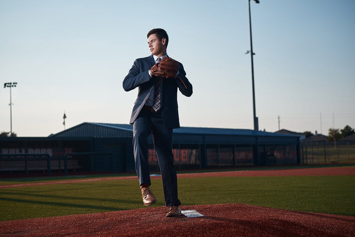 Mckinney north senior pitcher throwing from the mound in a suit