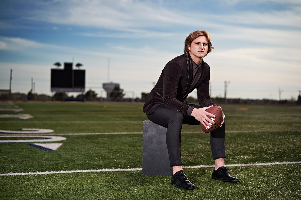 prestonwood plano senior pictures of football player with suit