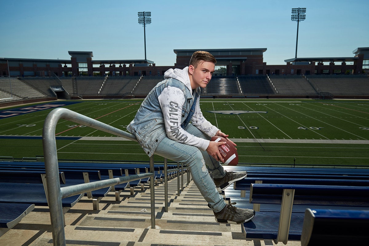 mckinney senior pictures of football player in stadium for info page
