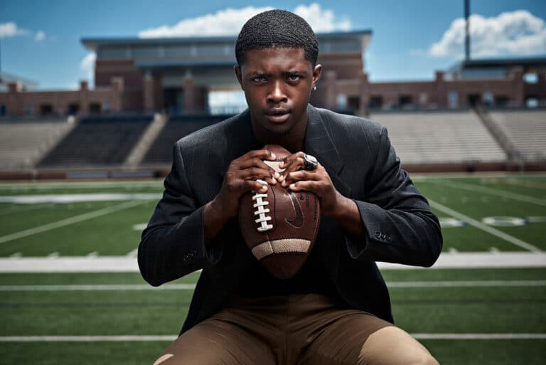 Allen Senior Pictures Football Player Crushing Ball