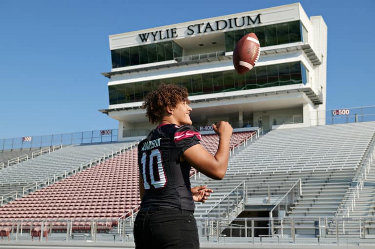 Wylie Football Senior Pictures In Stadium Tossing Ball