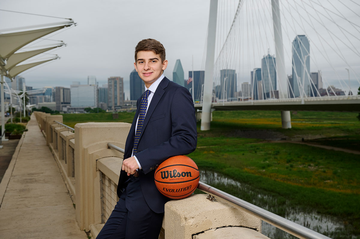 st marks senior pictures for boys basketball in downtown dallas on the bridge