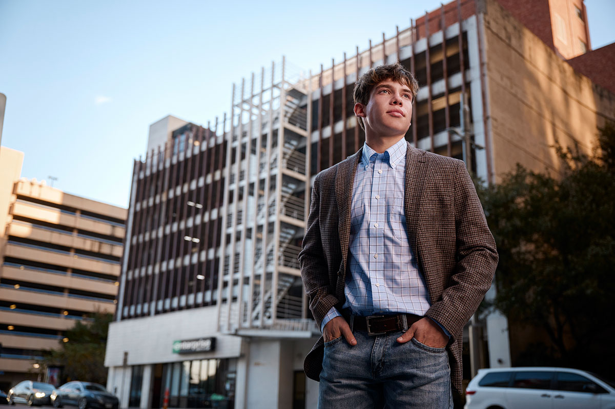 Allen senior pictures for guys in jeans and blazer downtown