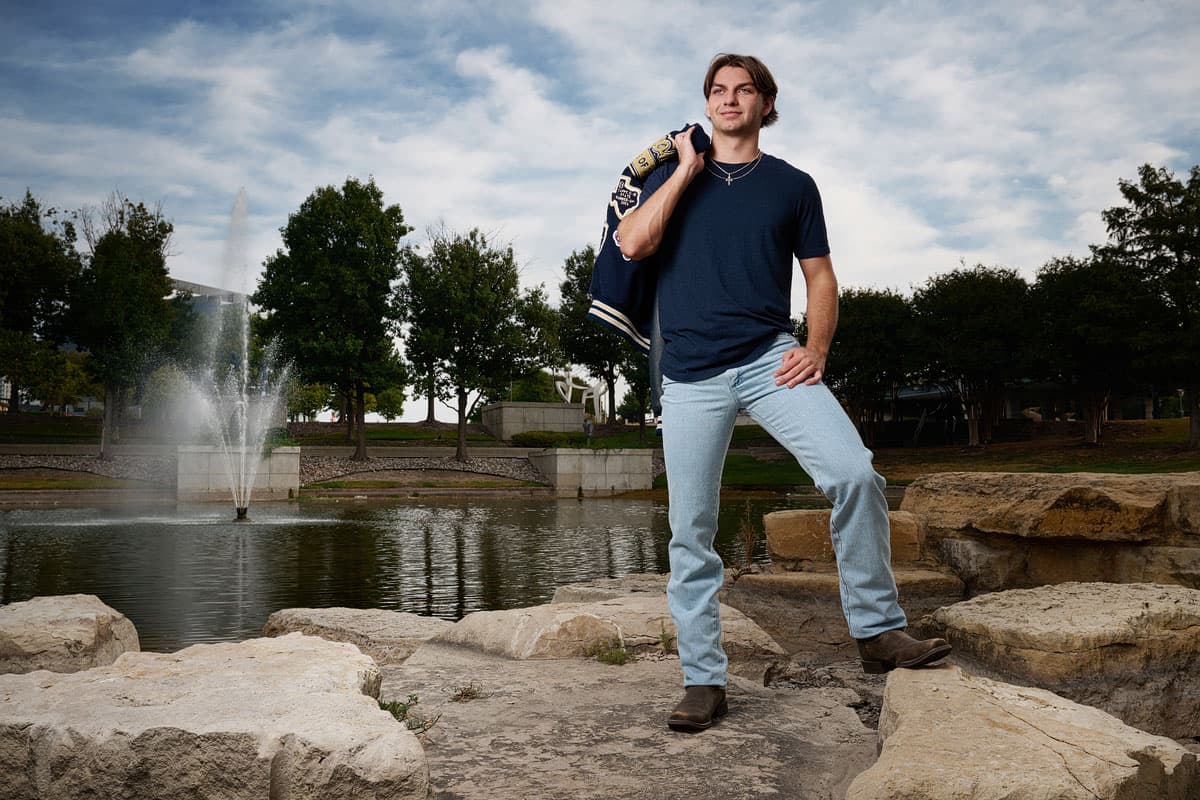Mckinney Christian Senior Pictures Letterman Jacket On Rocks Park Photographer 003